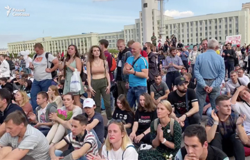Thousands Of Minskers Sitting On Pavement In Independence Square, Showing Action As Peaceful