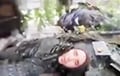 «Слушай, добей, а?»: украинский воин спасает оккупанта, которого прижало к стене БТРом