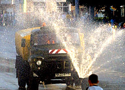 Street sprinklers against participants of the solidarity rally
