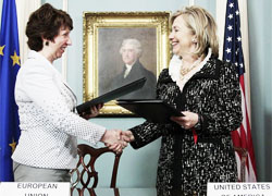 Hillary Clinton and Catherine Ashton stand against Lukashenka