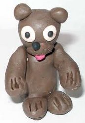 Commission member modeling teddy bears out of  the plasticine for ballot box sealing