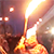 На олимпийском факелоносце загорелась шапка (Видео)