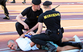 Photo-Fact: Smiling Brest Dynama Fan Against Two Riot Policemen